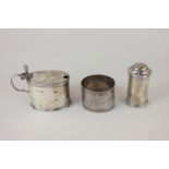An Edward VII matched silver mustard and pepper, makers Goldsmiths & Silversmiths Co Ltd, London