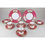 A Victorian porcelain part tea set with hand painted panels of birds, with pink border with gilt