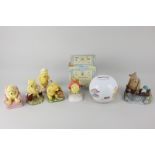 Five Royal Doulton porcelain figures of Winnie the Pooh, from the Winnie the Pooh collection,