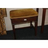 A rectangular adjustable piano stool on square tapered legs (one turning handle missing), 53cm