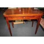 A mahogany tea table, with fold-over rectangular shaped top and drawer, on square tapered legs,