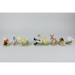 Seven Royal Doulton porcelain figures from the Winnie the Pooh collection, Christopher Robin and