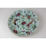 A Chinese celadon plate depicting birds, butterflies and flowers, seal mark to base, 24.5cm