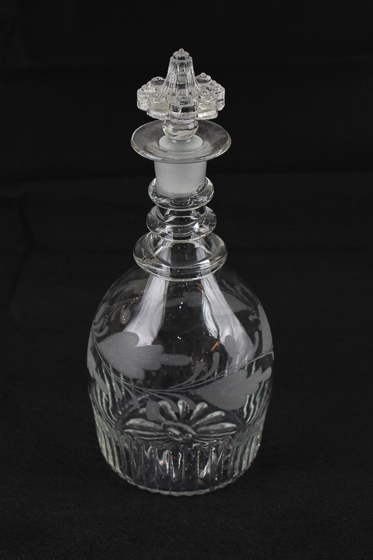 An etched glass decanter, mallet shape with foliate decoration and fluted base, 25cm high