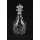 An etched glass decanter, mallet shape with foliate decoration and fluted base, 25cm high
