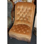 A Victorian button upholstered slipper chair in gold colour, on turned legs