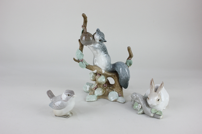 A Lladro porcelain figure group of a squirrel on a branch, 23cm, together with a Lladro model