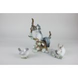 A Lladro porcelain figure group of a squirrel on a branch, 23cm, together with a Lladro model