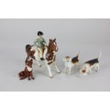 Four Beswick porcelain models, girl on skewbald pony (1499) (a/f), a seated fox (1748) (a/f), and
