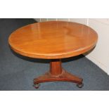 A Victorian circular tilt top tea table on octagonal pedestal and tri-form base 101cm diameter