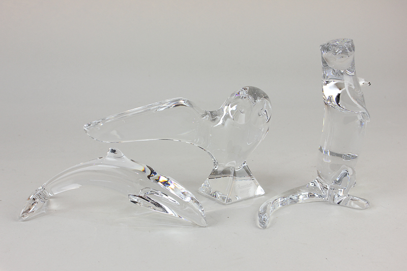 Three Baccarat clear glass models of animals comprising an owl marked R Rigot, 10.5cm, an otter,