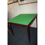A modern stained wood card table, square with green baize inset, on four folding legs, 77.5cm