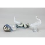 A collection of three Lladro porcelain models of geese and goslings, tallest 12cm