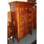 An Edwardian inlaid mahogany tall chest, flared top with frieze drawers above five further