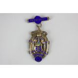 A George V silver gilt and enamel medal, The Worthing & West Sussex District Grocers & Provision