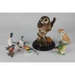Seven Beswick porcelain models of birds, pheasant, first version (767a), small medium and large