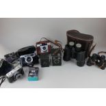 A Kodak Box Brownie Junior camera, a Kodak Hawkeye Ace de Luxe, a pair of Brownie binoculars, a pair