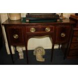 A Sheraton style inlaid mahogany bow front sideboard with central drawers flanked by two