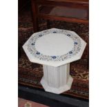Two similar octagonal marble side tables, each with floral inlaid top on column base, 56cm and