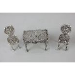 A Victorian imported silver miniature model of a table with two chairs, retailed B Muller & Son,