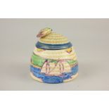 A Clarice Cliff for Newport Pottery Gibraltar beehive honey pot, decorated with sailing boats