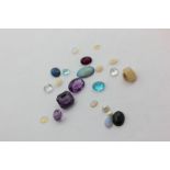Twenty-two various unmounted gem and hardstones, and seed pearls