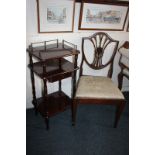 A mahogany three-tier side table with brass rail three-quarter gallery top, central drawer on turned