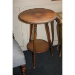 An Edwardian inlaid mahogany side table, circular top with central pinwheel motif, on three turned