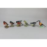 A collection of six Beswick models of birds, comprising a goldcrest, 6.5cm, a bullfinch, 6cm, a