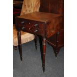 A mahogany drop-flat side table with two drawers and two opposing dummy drawers, with ebony line