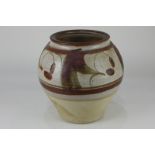 A studio pottery vase by Don Glanville for Wolf House Gallery, with half glazed stylised design,