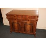 A Victorian walnut sideboard with rectangular top above four graduated drawers with turned knob