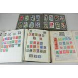 Three albums of Victorian and later British and world stamps including a penny red, and a
