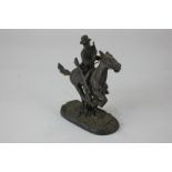 After Frederick Remmington, cowboy on a galloping horse, bronze, bearing signature to base, 12cm