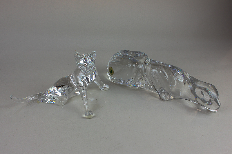 A Baccarat clear glass model of a cat, 11.5cm, together with a Waterford crystal model of a panther,