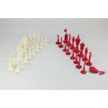 A Chinese export ivory and stained red chess set, height of King 10cm (a/f)