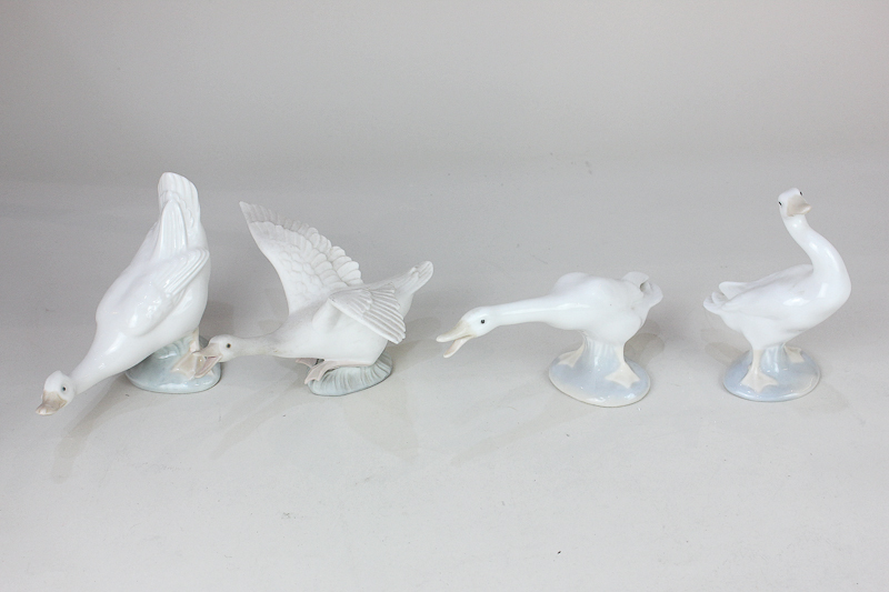 Three Lladro porcelain models of white geese in various poses, one unglazed, 8cm, together with a