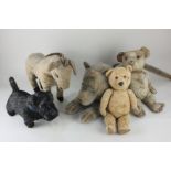 A Chiltern donkey from a pull-along toy, together with two early 20th century teddy bears, a black