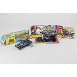 A Corgi Toys Batmobile die cast mode toy car number 267, with Batman and Robin figures, boxed (a/f),