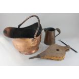 A copper coal bucket, with swing handle, a copper jug and a pair of wooden bellows (a/f)