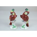 A pair of Chelsea style porcelain models of parrots, with gold anchor mark, 17cm