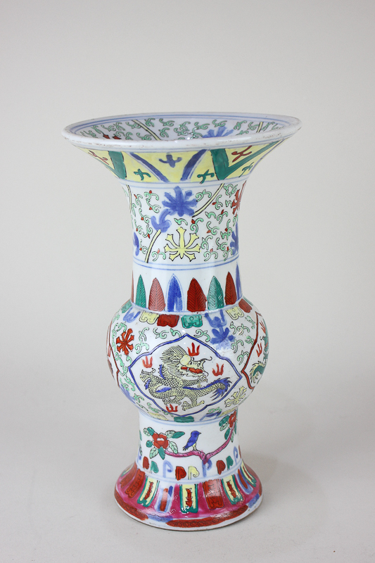 A Chinese porcelain baluster vase with flared rim depicting four polychrome dragons, character marks