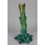 A 19th century Minton Majolica candlestick modelled as reeds, the base stamped 1900, 32cm high