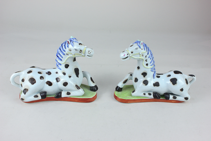 A pair of Vista Alegre porcelain models of horses, the bases marked The Nelson Rockefeller