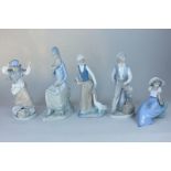 Four Nao figures including a girl in the wind with dropped hat box and a boy on a water hydrant