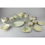 A Carlton Ware porcelain part tea and breakfast set, decorated with pink foxgloves on yellow