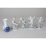 A Royal Copenhagen porcelain bud vase decorated with blue flowers, 12.5cm high, together with a