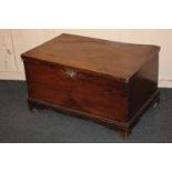 A George III possibly elm rectangular trunk, on moulded edge base and bracket feet, later repairs (