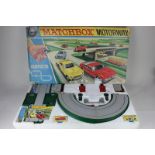 A "Matchbox" Motorway M-2 model racing set, to include five boxed Matchbox cars and four others (a/f