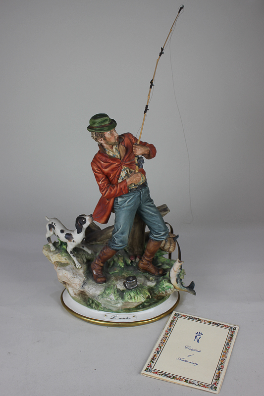 A Capodimonte porcelain figure of a fisherman with his dog, 'Help', L'aiuto, by Sandro, 47cm high